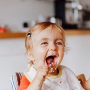 Baby eating in a high chair