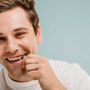 Man flossing his teeth